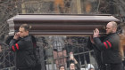 Workers carry Alexei Navalny’s coffin to the church in Moscow.