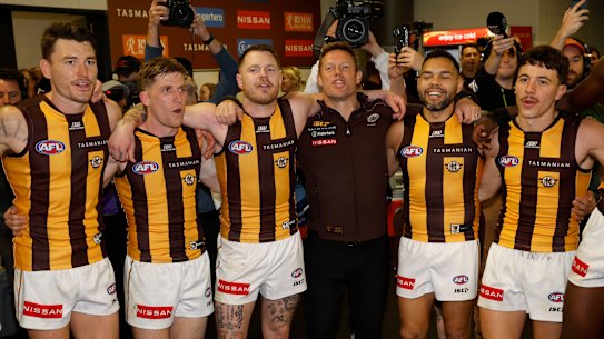 Josh Battle, Dylan Moore, Blake Hardwick, Sam Mitchell, Jarman Impey and Massimo D’Ambrosio belt out the song after eliminating the Giants on enemy soil.