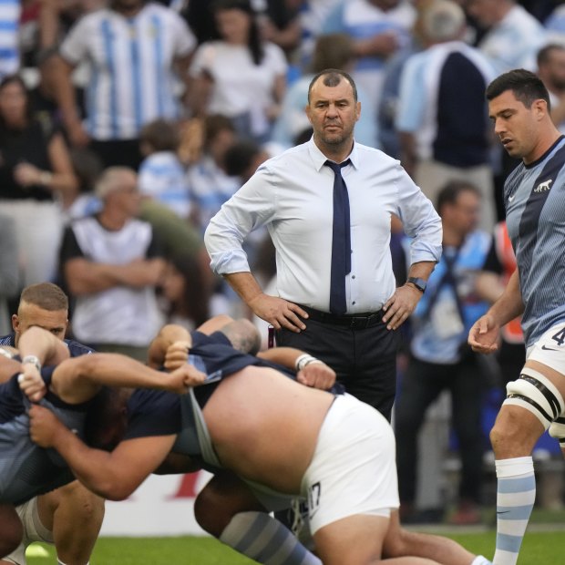 Argentina’s head coach Michael Cheika looks at his players warming up before the Rugby World Cup quarter-final match between Wales and Argentina.