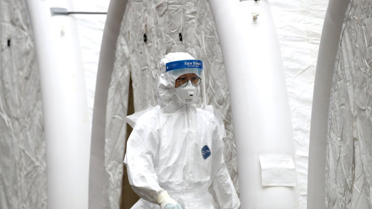 A medical professional at the National Medical Centre where patients suspected of contracting coronavirus are assessed in Seoul, South Korea. 