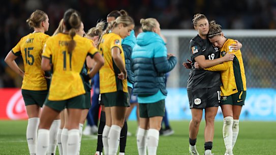 Australia players look dejected after the team’s 1-3 defeat and elimination from the tournament.