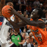 CAIRNS, AUSTRALIA - JANUARY 30: Bul Kuol of the Taipans goes to the basket under pressure from Robert Franks during the round 17 NBL match between Cairns Taipans and Adelaide 36ers at Cairns Convention Centre, on January 30, 2023, in Cairns, Australia. (Photo by Emily Barker/Getty Images)