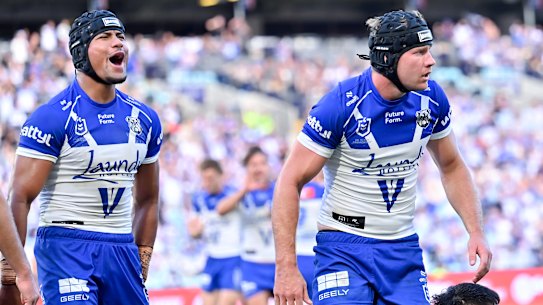 Stephen Crichton and Matt Burton celebrate a Bulldogs try.
