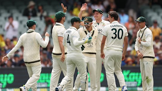 Cameron Green and Pat Cummins of Australia celebrate the wicket of Tagenarine Chanderpaul.