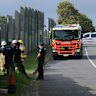Emergency services at the scene of a crash near Wooloowin train station in northern Brisbane, where a car crashed through a fence and onto the railway line. December 16, 2025.