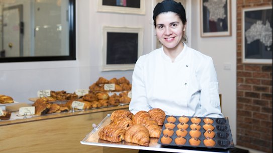 Agathe Kerr with some of the offerings that have put her South Melbourne market pâtisserie stall on the international tourist map, thanks to TikTok.