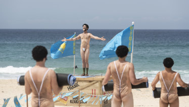 A group of impersonators take part in "Borat yoga" to promote the new film.