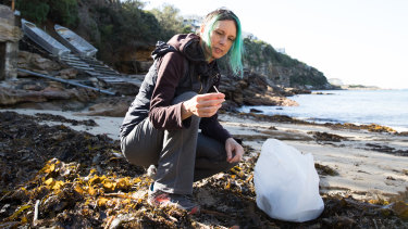 Marina DeBris collects plastic straws from Gordons Bay, Coogee.