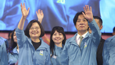 Taiwan President and Democratic Progressive Party presidential candidate Tsai Ing-wen, left, waves to supporters while launching her re-election campaign in Taipei, Taiwan.