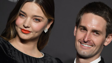 A sad homecoming for model Miranda Kerr and her billionaire husband Evan Spiegel who have quietly flown into Sydney.