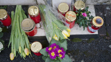 Flowers are set at a house of a doctor, who died in an explosion by a booby trap in Enkenbach-Alsenborn, Germany.