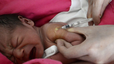 A baby receives a vaccine shot at a hospital in Handan in north China's Hebei province.