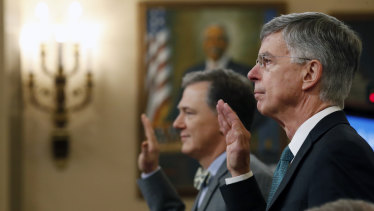 Top US diplomat in Ukraine William Taylor, right, and career Foreign Service officer George Kent, left, are sworn in to testify at the first public impeachment hearings into President Donald Trump this week. 