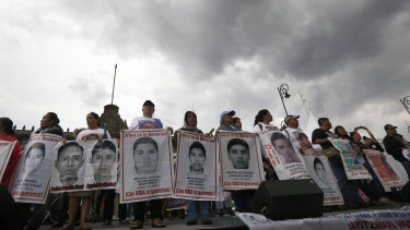 Relatives and students of 43 students from the Isidro Burgos rural teachers college, who disappeared four years ago, hold a protest on the anniversary of their disappearance in Mexico City.