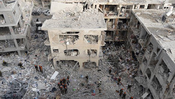 Soldiers search for trapped people after the overnight missile strike in Bat Yam.