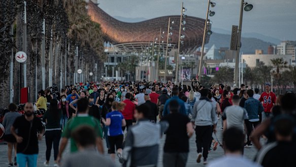 People filling the street in Barcelona on Saturday, able to exercise for the first time in months.