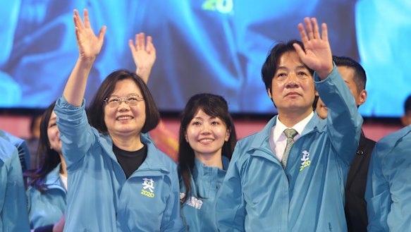 Taiwan President and Democratic Progressive Party presidential candidate Tsai Ing-wen, left, waves to supporters while launching her re-election campaign in Taipei, Taiwan.
