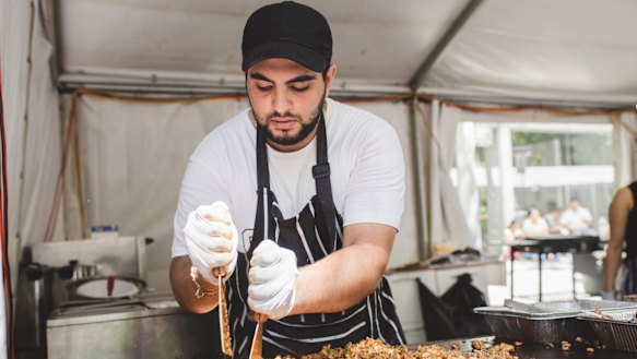 Sorial Ibraheil of the mercy association making chicken shawarma at the National Multicultural Festival last year.
