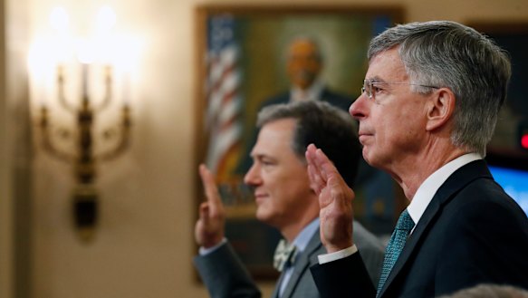 Top US diplomat in Ukraine William Taylor, right, and career Foreign Service officer George Kent, left, are sworn in to testify at the first public impeachment hearings into President Donald Trump this week. 
