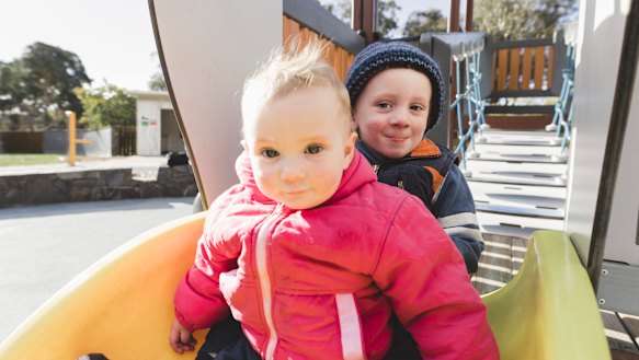 Elliot Banyer, 2, and his sister, Josie, 10 months. Elliot loves playing in the sand, while Josie likes going down the slide. 
