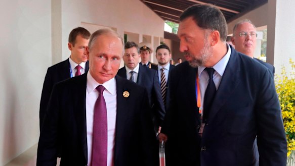 Russian metals magnate Oleg Deripaska, pictured with President Vladimir Putin, is one of several oligarchs to have sanctions placed on them.