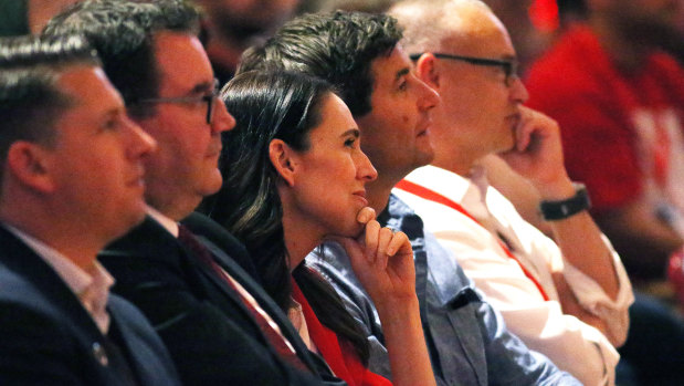 NZ PM Jacinda Ardern, centre, and delegates in the audience at the Labour Party conference. The party goes to the next election on a high.