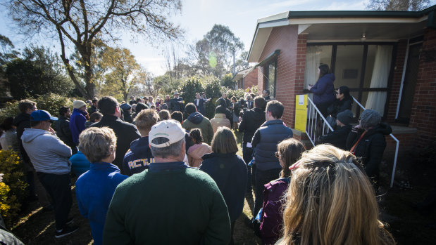 Hundreds of people attended the auction of the Watson home, which sold for $761,000.