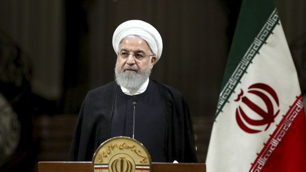 Iranian President Hassan Rouhani listens during a joint press conference with Japanese Prime Minister Shinzo Abe in Tehran.