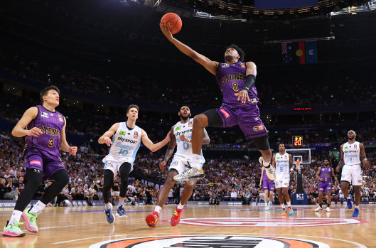 On the move: Sydney’s Justin Simon takes the ball to the rim on Wednesday night.