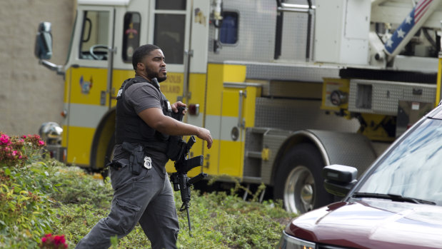 Maryland police officers patrol the area after multiple people were shot at a newspaper in Annapolis, Maryland.