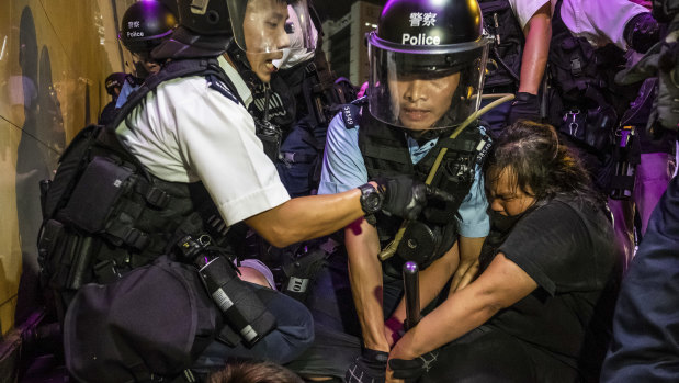 Police officers make arrests in the Sha Tin district in July.