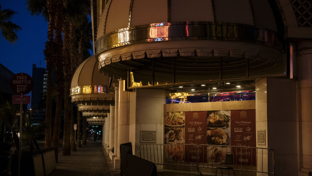 Lights illuminate an empty sidewalk in Las Vegas, Nevada.