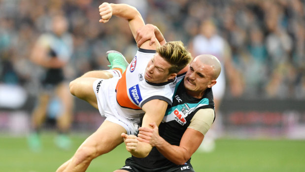 Spicy contest: Sam Powell-Pepper gets to grips with Giant Toby Greene.