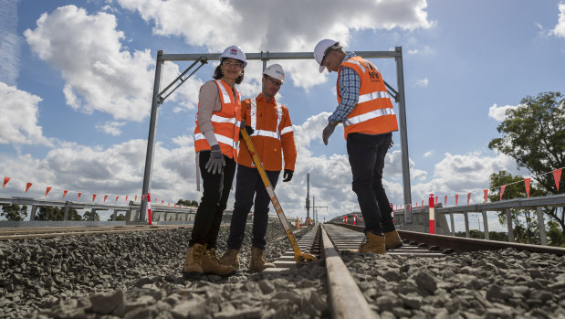 Premier Gladys Berejiklian and Infrastructure Minister Andrew Constance at Bella Vista, where the last sleepers for the Metro North West project were locked down in April.