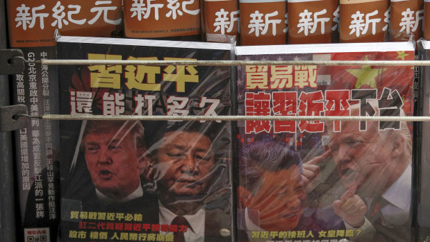 Chinese magazines with front covers featuring Chinese President Xi Jinping and US President Donald Trump on trade war are placed for sale at a roadside bookstand in Hong Kong. China.