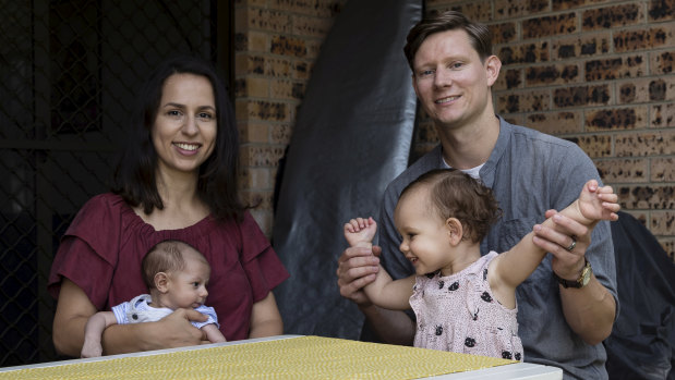 Hew Nunn, a pastor at the Grace City Church with his Iranian-born wife Cindy and their two children Florence and Saxon Wild at their Narrabeen apartment.  They want to have more children, but can't because they are renting.