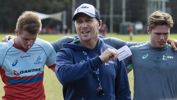 Junior Wallabies coach Jason Gilmore addresses the squad at training on Sunday. 