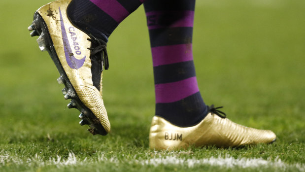 Golden: Cameron Smith wears special boots to mark his milestone match.