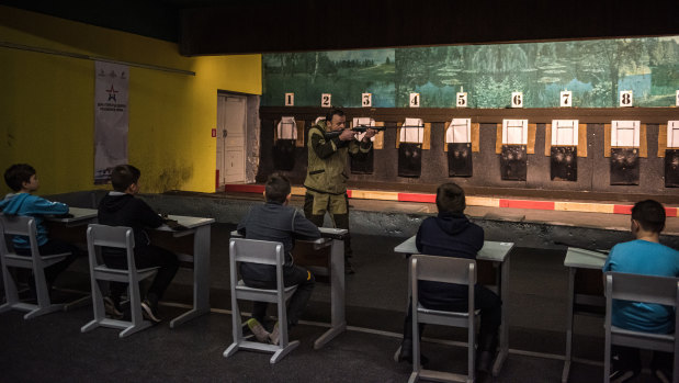 An instructor shows children how to use air rifles at the Youth Pre-Recruitment training centre in Noginsk near Moscow last week.