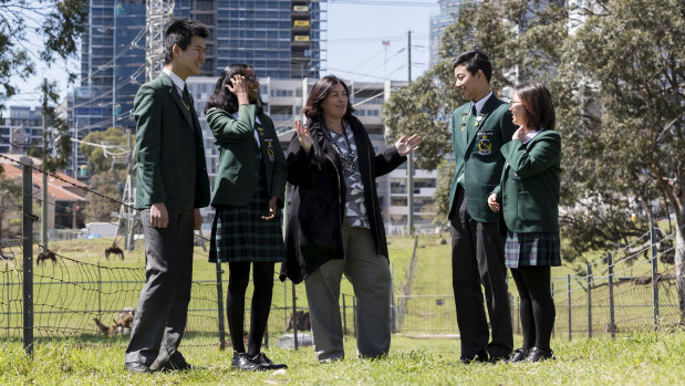 James Ruse Agricultural High Principal Megan Connors chats with students in the school's paddock.