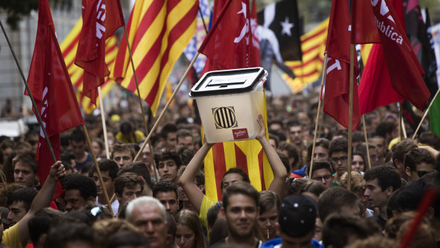 Pro-independence demonstrators march during a protest in Barcelona on Monday. 
