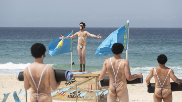 A group of impersonators take part in "Borat yoga" to promote the new film.
