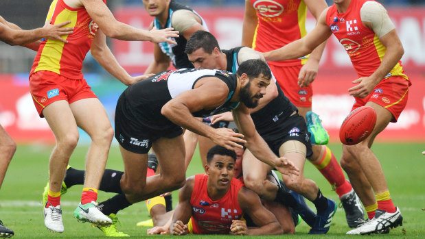Stacks on: Port Adelaide ruckmnan Patrick Ryder gets down low against Gold Coast in Shanghai.