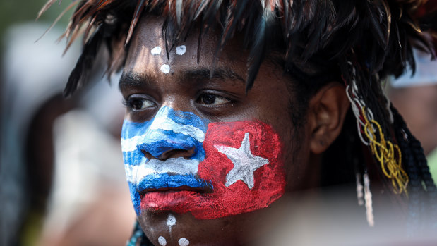 A Papuan student protests in Jakarta  last August with face painted in the colours of the banned separatist "Morning Star" flag.