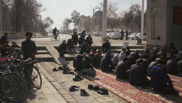 Muslims pray during Friday service in Bukhara, Uzbekistan.