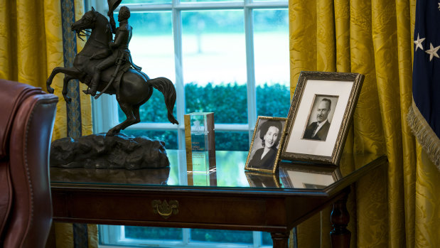Portraits of President Donald Trump’s parents, Mary Anne MacLeod Trump and Fred Trump, in the Oval Office.