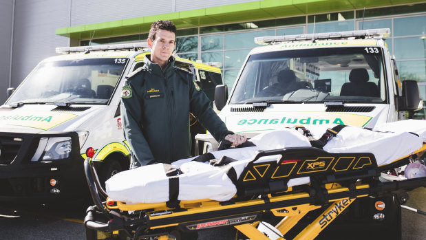 Intensive care paramedic Brendan Kelly with a new electric stretcher.