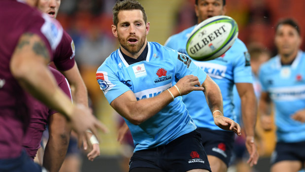 Hunted: Bernard Foley helped the Tahs to a big win over the Reds in the last Super Rugby game before the Test window.