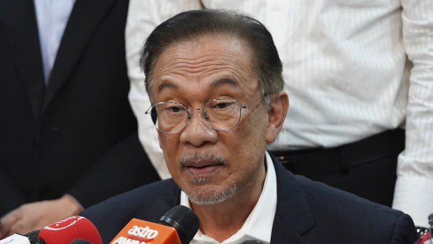 Anwar Ibrahim speaks during a press conference at the headquarters of the Alliance of Hope after meeting the king in Kuala Lumpur, Malaysia, on Wednesday.