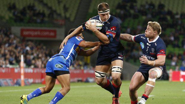 The Rebels' Luke Jones (centre) is tackled in the match against the Stormers.